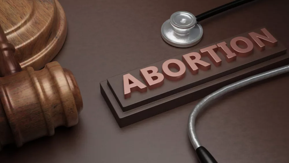 abortion-law-and-health-legal-or-illegal-text-medical-stethoscope-and-judge-gavel-3d-render-text-and-judge-gavel-3d-render