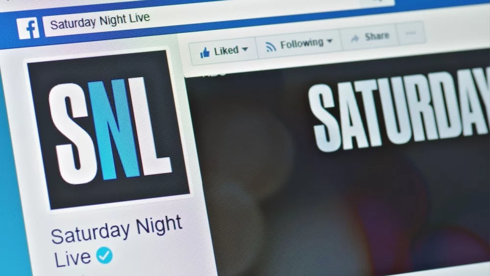 A computer screen shows details of Saturday Night Live page on Facebook web site. Selective focus.