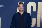Alan Ritchson at the 2022 Academy of Country Music Awards Arrivals at Allegient Stadium on March 7^ 2022 in Las Vegas^ NV