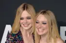 Elle Fanning & Dakota Fanning arriving at the Saint Laurent at the Palladium fashion show at the Hollywood Palladium. LOS ANGELES^ CA - FEBRUARY 10^ 2016