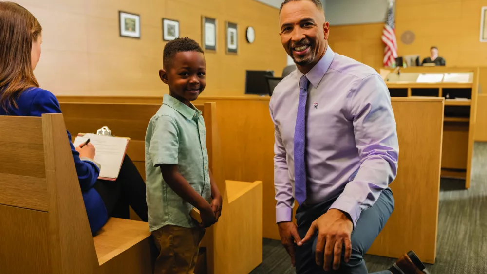 volunteerchild_courtroom_tocamera-scaled-1436247