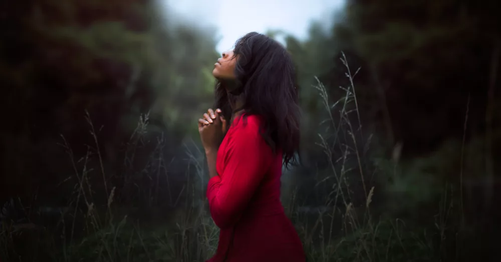 20056-woman-praying-diana-simumpande-unsplash-4845203