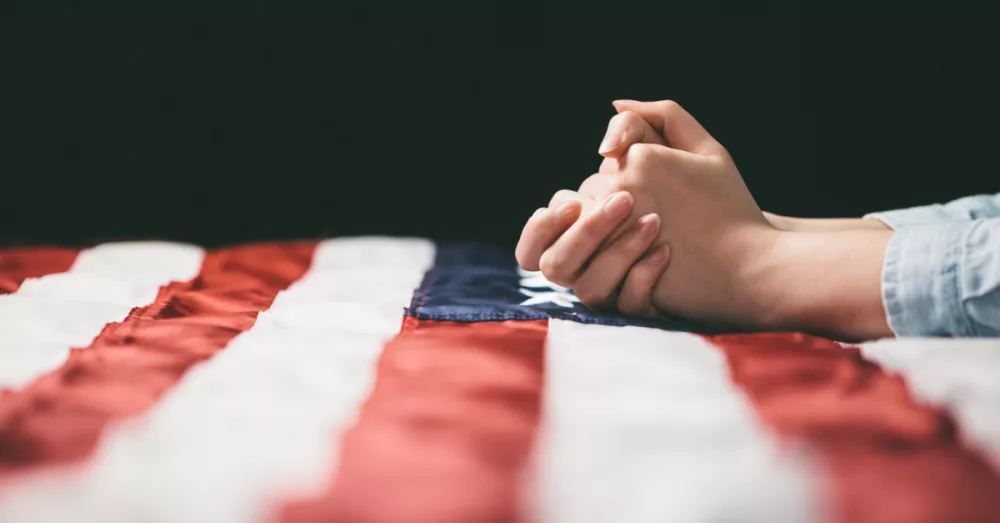 25401-america-prayer-getty-images-4maksym466559