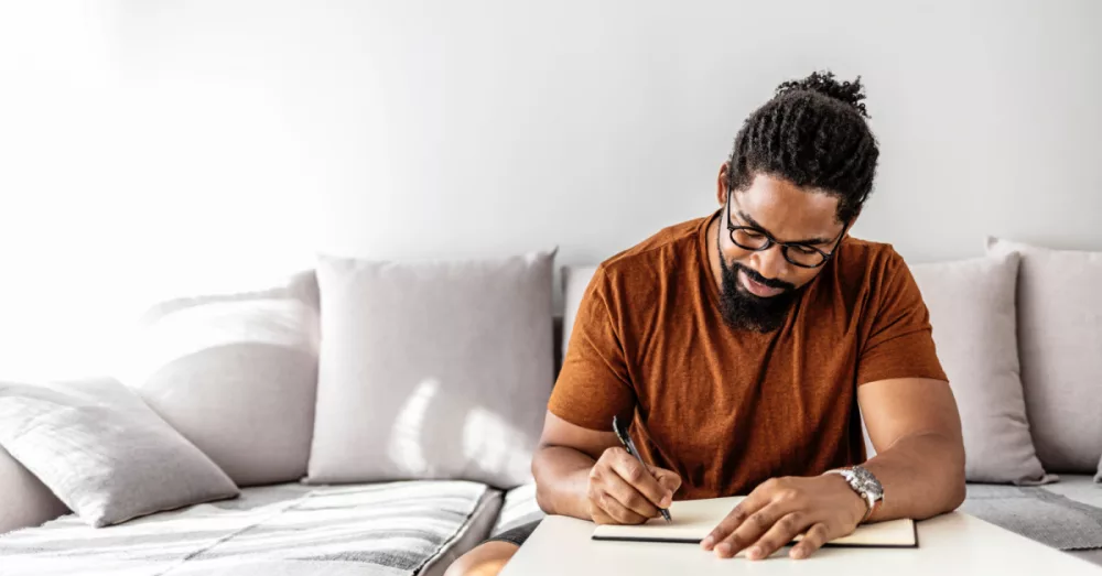 30540-man-journaling-gettyimages-ljubaphoto_source_file470862