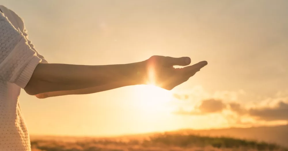 15742-woman-arms-out-at-sunrise-giving-burdens-to-g574521