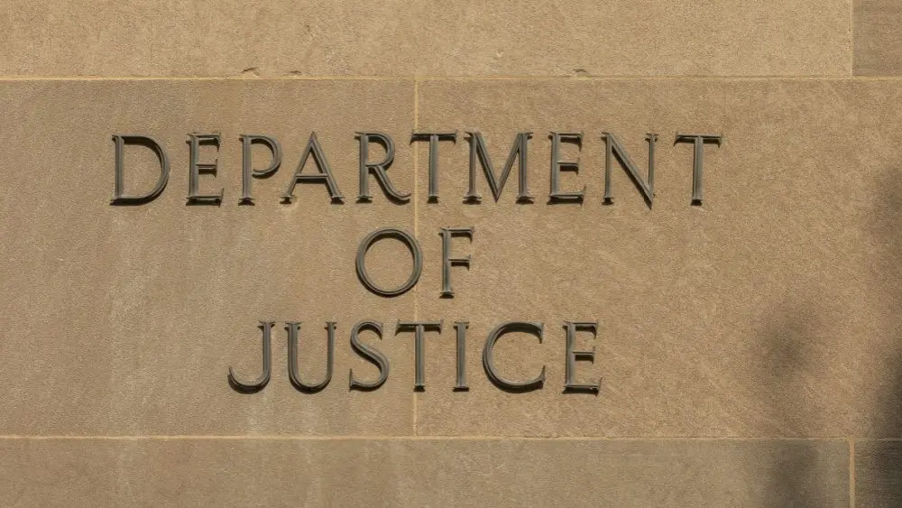 Sign "Department of Justice" on the Facade of the DoJ Building Washington^ DC^ USA - 16 July 2021