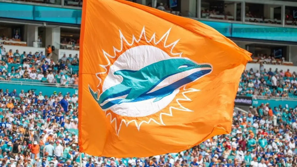 MIAMI DOLPHINS Flag flies streaks across the field after a "Fins" touchdown. Miami Dolphins vs. NY Giants at HardRock Stadium. Miami Gardens^ FLUSA - October 08^ 2023