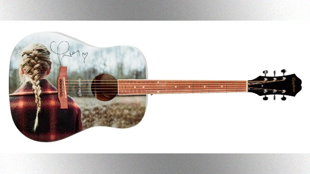 m_taylorswiftauctionguitar_020623601442
