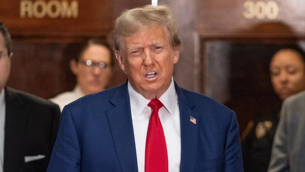 Former President Donald Trump speaks to the press before closing arguments at his civil fraud trial at State Supreme Court in New York on January 11^ 2024