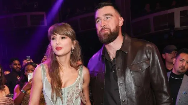 getty_taylorswiftandtraviskelcewalkingiheart_050826667205