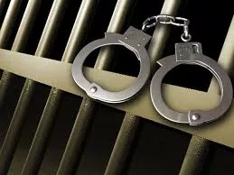 arrest-5-hancuffs-on-right-with-cell-bars17471