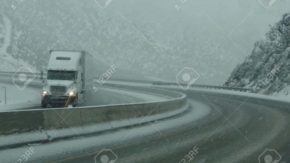 9802628-tracker-trailers-drive-cautiously-on-icy-roads-in-eastern-oregon
