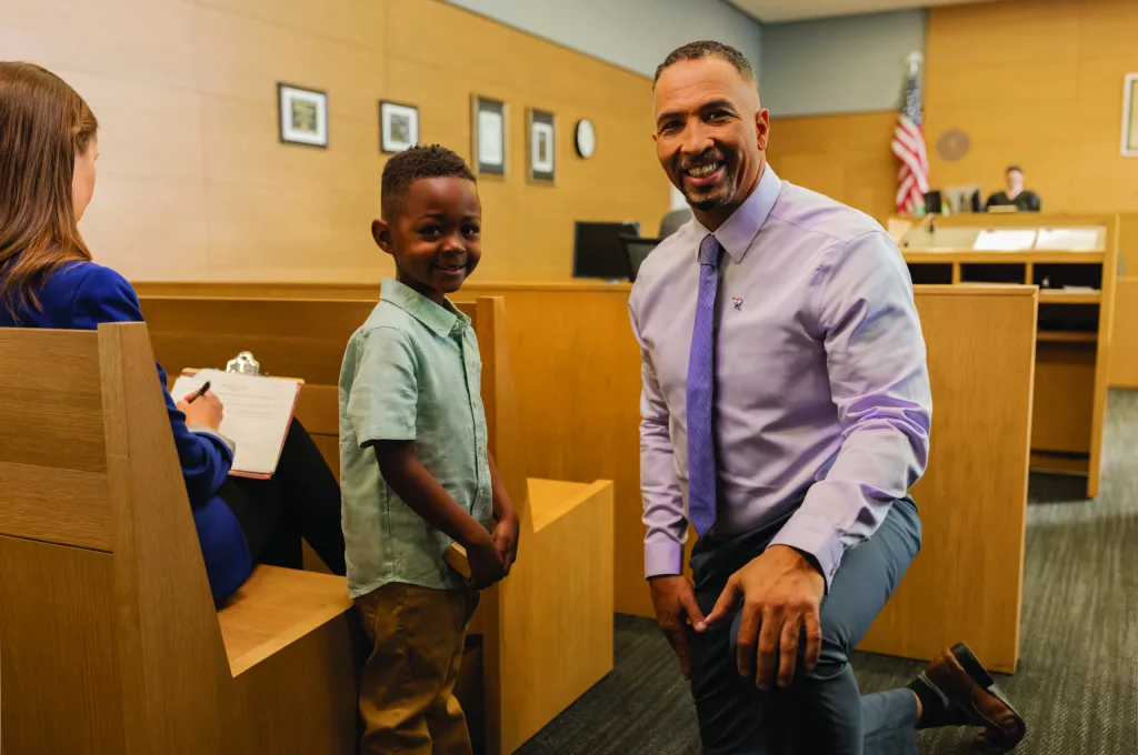 volunteerchild_courtroom_tocamera-scaled-1823358