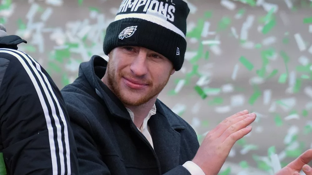 quarterback Carson Wentz celebrate the Super Bowl LII win during a parade Feb. 8^ 2018^ in downtown Philadelphia.