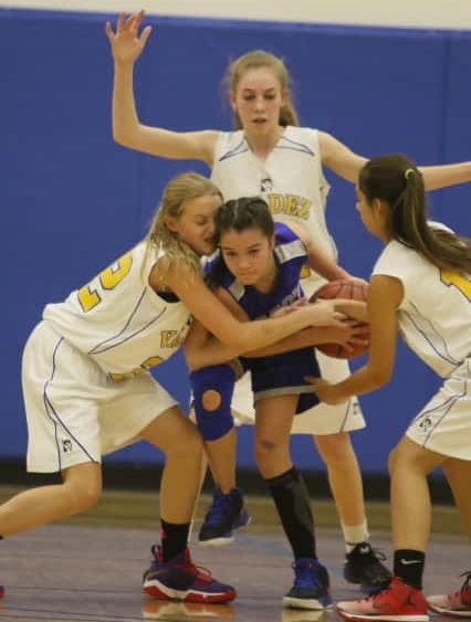 masen-holmes-carsyn-hinkle-and-kylie-gilbert-fletcher-trap-a-cordova-player-during-a-game-friday