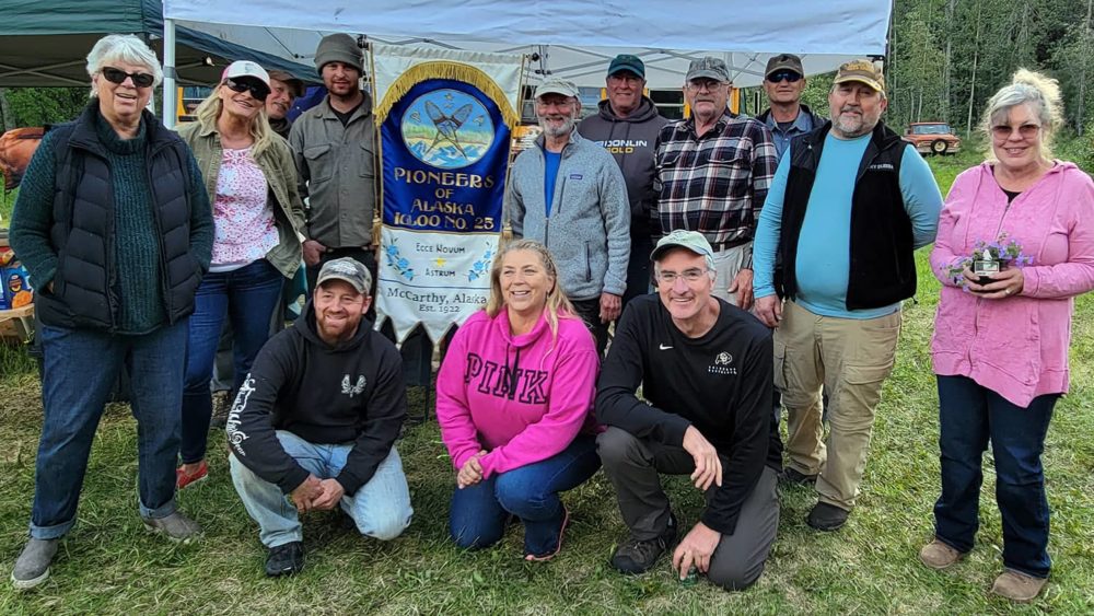 the-new-ceremonial-members-of-mccarthy-igloo-no-25-pose-with-an-igloo-banner-at-the-pioneers-of-alaska-solstice-stampede-in-mccarthy-alaska-2