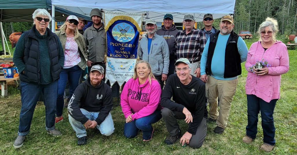 the-new-ceremonial-members-of-mccarthy-igloo-no-25-pose-with-an-igloo-banner-at-the-pioneers-of-alaska-solstice-stampede-in-mccarthy-alaska-2