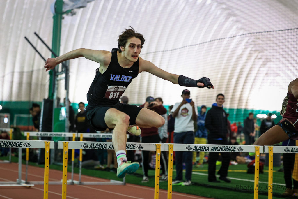 Dillon Fowler running hurdles