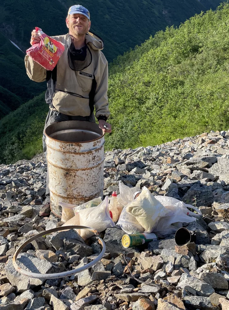 Glaciologist Martin Truffer holds raisins that had been preserved for more than 20 years in a barrel cache scientists left on Fireweed rock glacier near McCarthy. Photo by Ned Rozell.