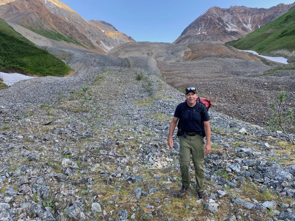 Ned Rozell walks on Fireweed rock glacier near McCarthy in July 2023. Photo by Adam Bucki.