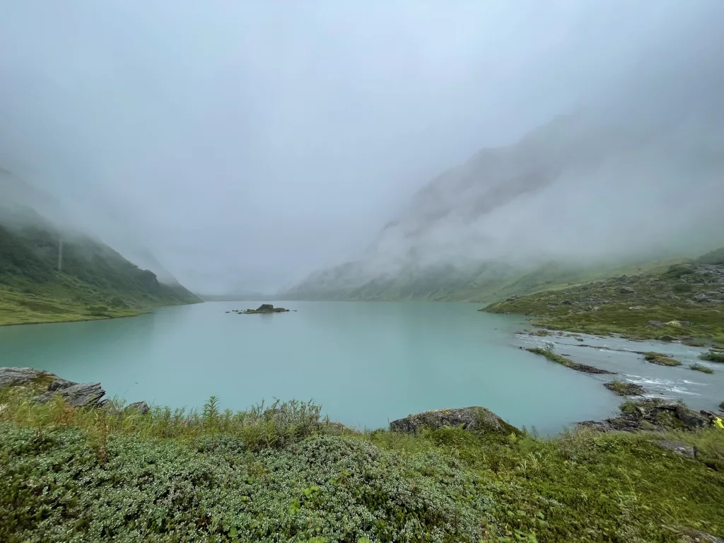 A steady rain falls on Allison Lake, a basin perched above Valdez in the Chugach Mountains. Photo by Ned Rozell.