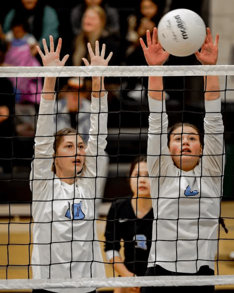 Rylee Wadeband Lola Compehos with a block, VHS Volleyball 