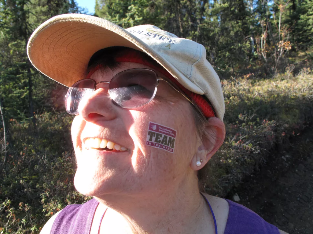 LJ Evans shows her temporary tattoo for Team in Training, a group that raised money for cancer research in exchange for training to run the race, during the 2009 Equinox Marathon. By Ned Rozell