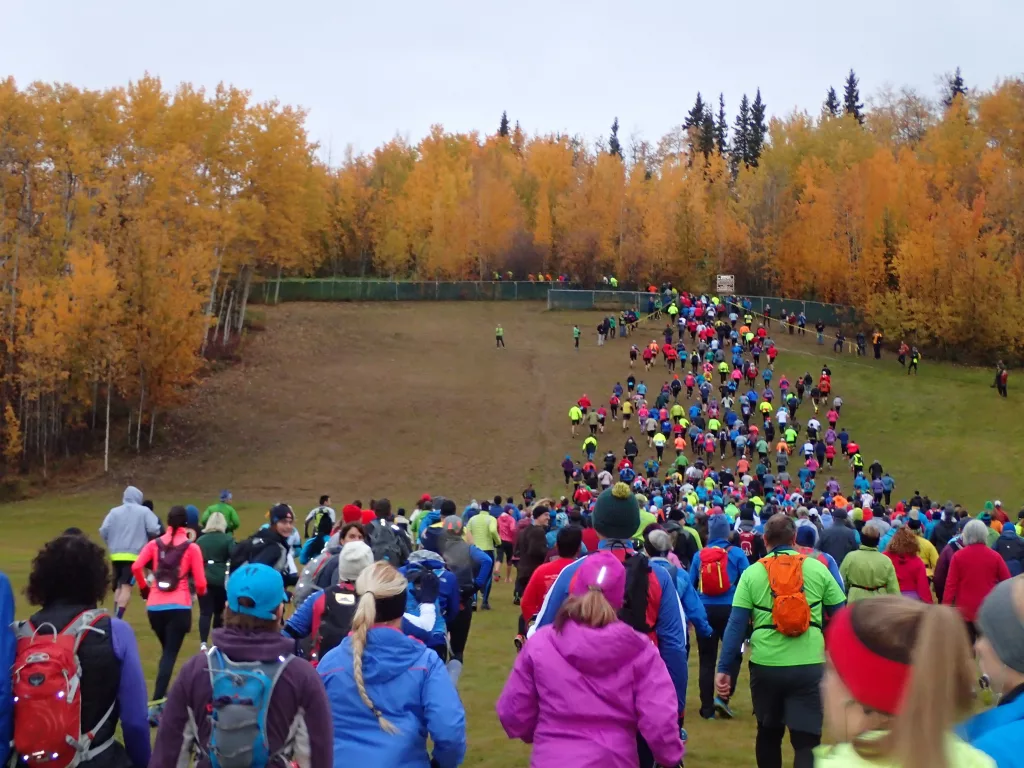 Runners ascend the old ski hill on the campus of the University of Alaska Fairbanks at the start of the 2015 Equinox Marathon. By Ned Rozell