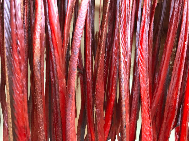 Strips from Tanana king salmon dry in a smokehouse in July 2019. Photo by Sam Bishop.