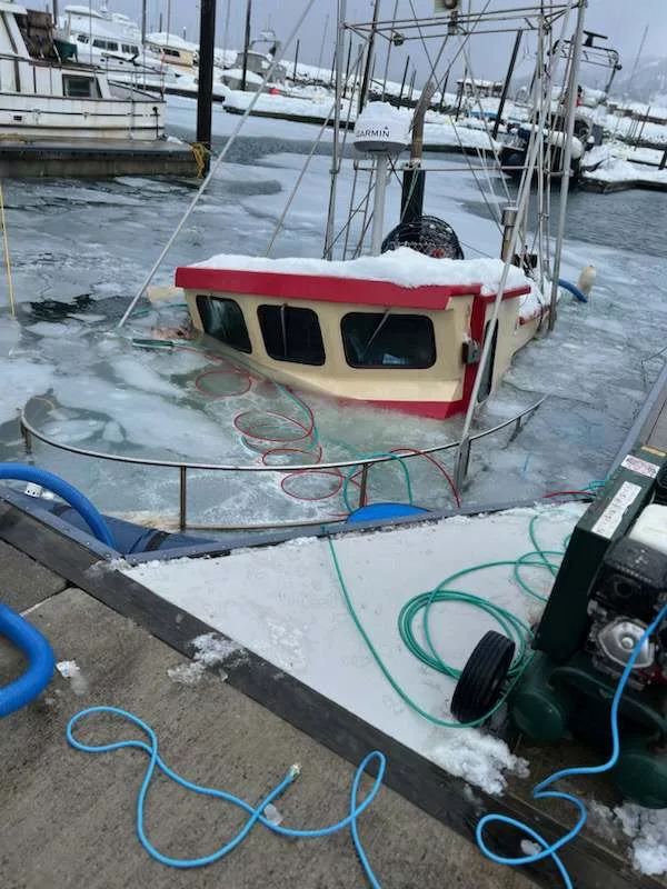 Boat sinking under snow weight