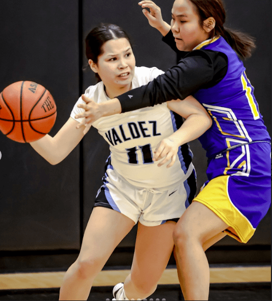 Kelli Malcuit drives past a Galena player