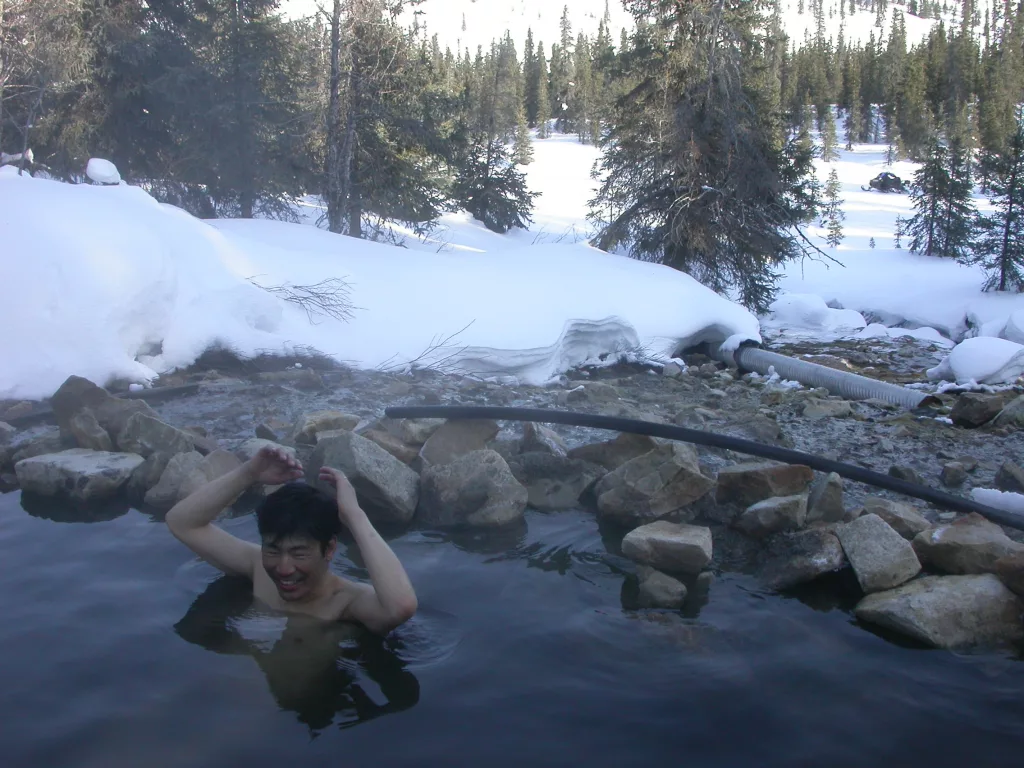 Tohru Saito soaks in Kwiniuk Hot Springs, located on the Seward Peninsula not far from the village of Elim. Photo by Ned Rozell.