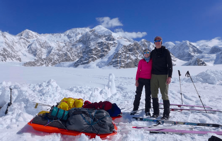 1. Kara Haeussler and her father Peter pose in front of the Kahiltna Peaks and Denali on June 3, 2014, at the conclusion of a trip during which they climbed mountains and collected rock samples. Photo courtesy of Peter Haeussler.