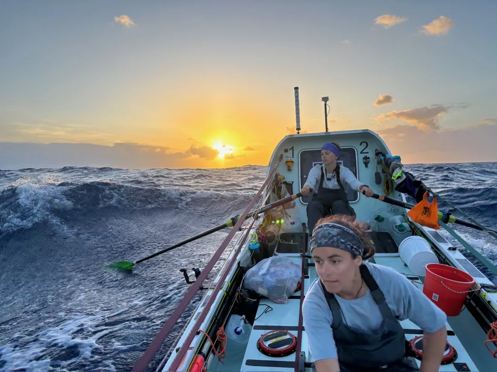 Lauren Shea, foreground, and Noelle Helder row into the sunset as they cross the Atlantic Ocean as part of a four-woman team. Photo courtesy Noelle Helder.