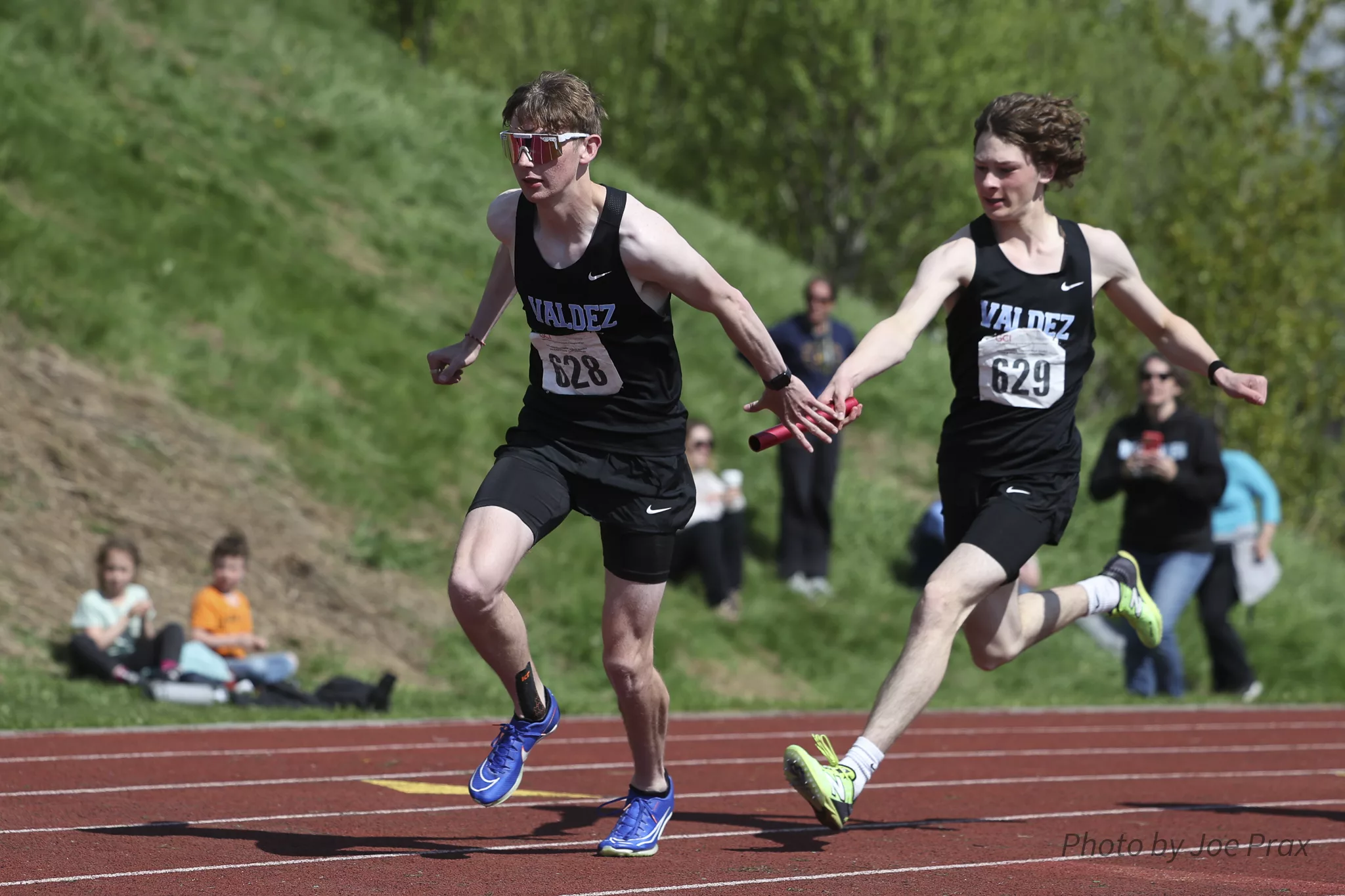 Track & Field State Championships, Merrick McCumby hands off to his brother Barrett in the relay