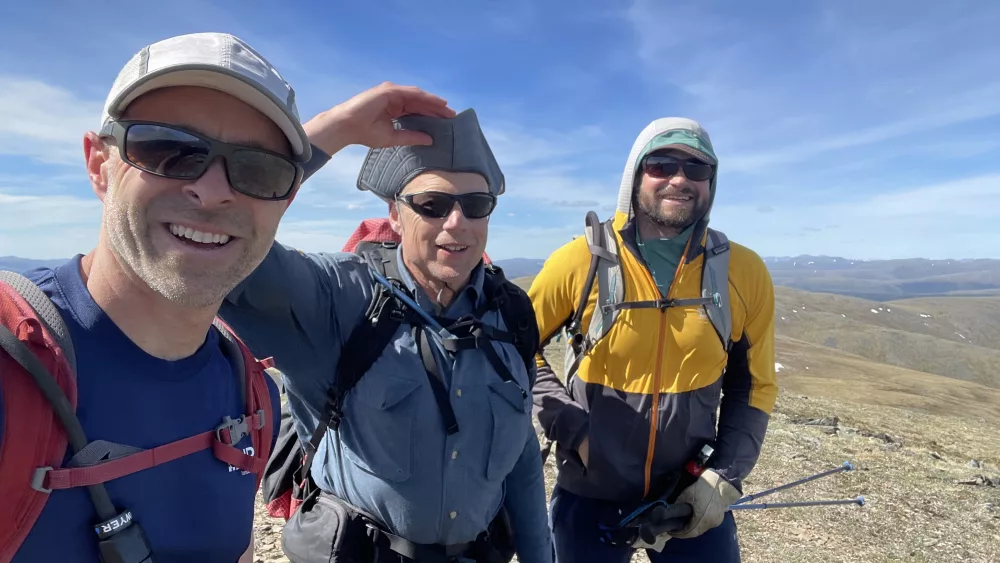 Bruno Grunau, Ned Rozell and Forest Wagner hike a ridgetop near Mastodon Dome in the AlaskAcross 2024, a 50-mile race. Photo by Bruno Grunau.