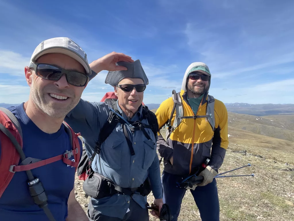 Bruno Grunau, Ned Rozell and Forest Wagner hike a ridgetop near Mastodon Dome in the AlaskAcross 2024, a 50-mile race. Photo by Bruno Grunau.