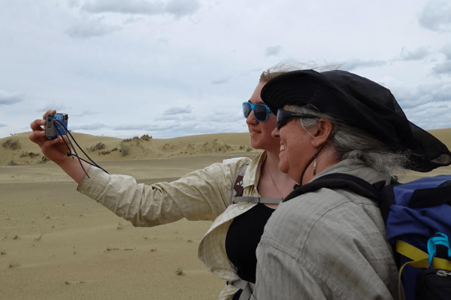 Fifteen-year-old Ida Bodony takes a selfie of herself and her mother Karin Bodony in the Nogahabara Dunes. They were there recently for a week to perform research recently in the heart of the Koyukuk National Wildlife Refuge. Photo by Ned Rozell.