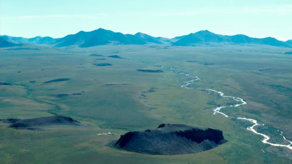 The Mesa Site rises just north of the Brooks Range in northern Alaska. Photo by Mike Kunz.