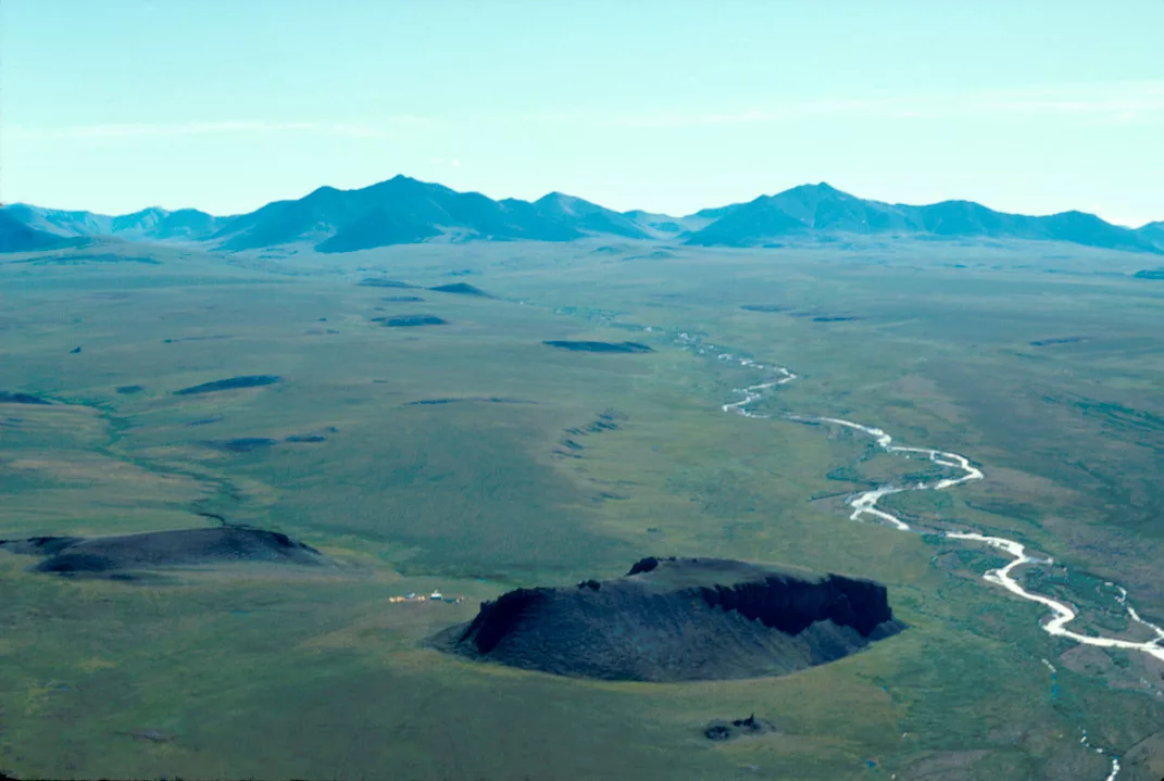 The Mesa Site rises just north of the Brooks Range in northern Alaska. Photo by Mike Kunz.