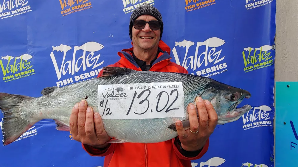 Joel Stephens of Ardmore, Oklahoma and his 13.02 lb silver salmon