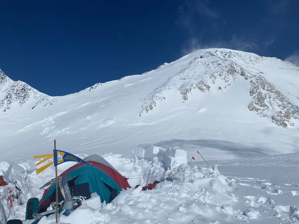 3. Snow blows near the summit of Denali, upper left, in this photograph from the 17,000-foot camp of Matthew Crisafi-Lurtsema and Roger Jaramillo. Photo by Matthew Crisafi-Lurtsema.