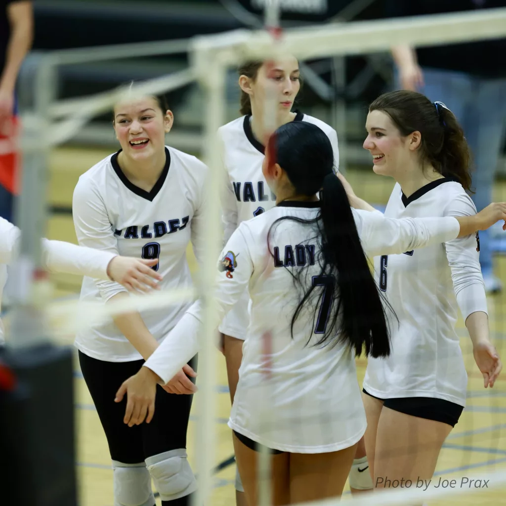 Varsity Volleyball team cheer. 