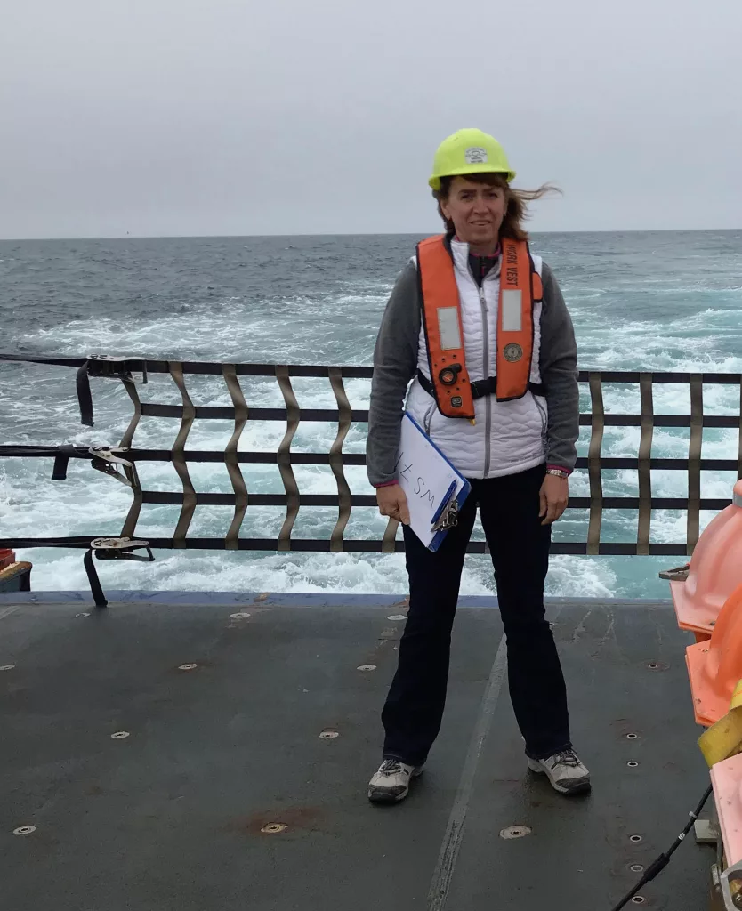 Seismologist Natalia Ruppert stands on the deck of the UAF ship the RV Sikuliaq during a research cruise for the Alaska Amphibious Community Seismic Experiment in July 2018. Photo courtesy Natalia Ruppert.