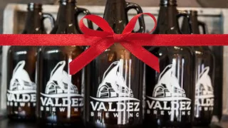 Valdez Brewing Growlers with bow on them