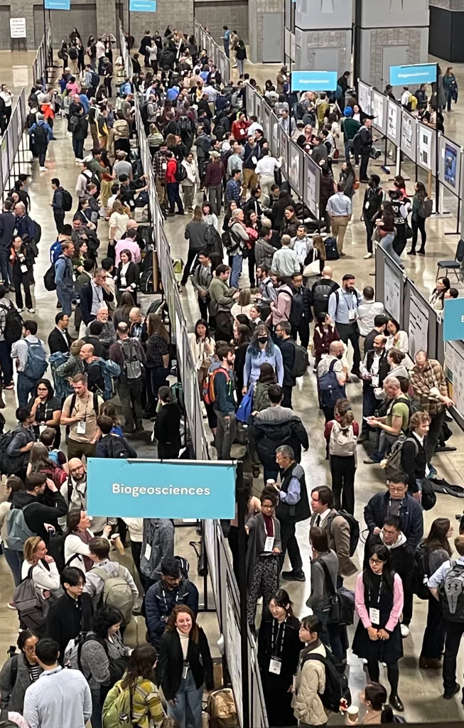 Some of the 25,000 attendees stand at a poster session during the 2024 Fall Meeting of the American Geophysical Union in Washington, D.C. Photo by Ned Rozell.