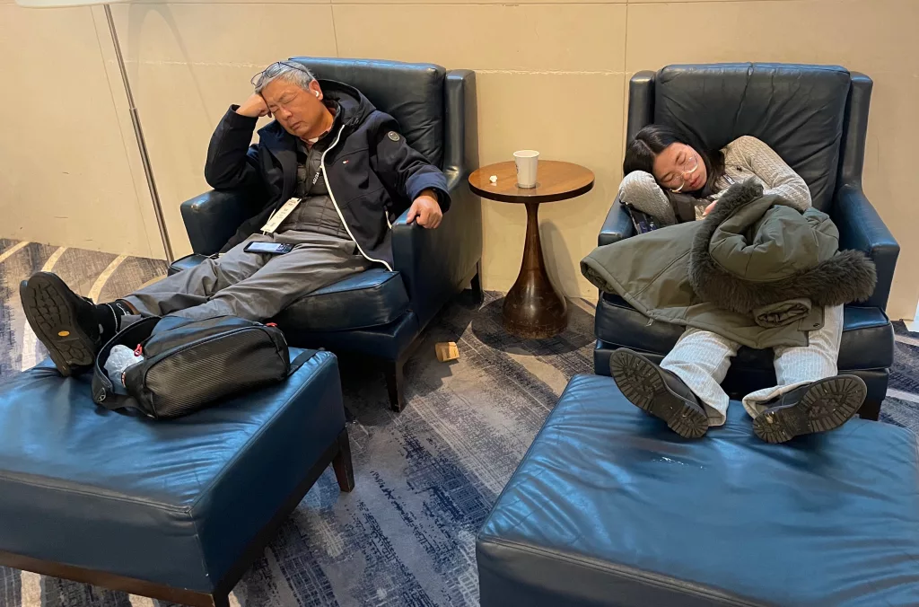 Two attendees of the 2024 Fall Meeting of the American Geophysical Union in Washington, D.C. take a break from its exhausting pace and probably also some jet lag. Photo by Ned Rozell.