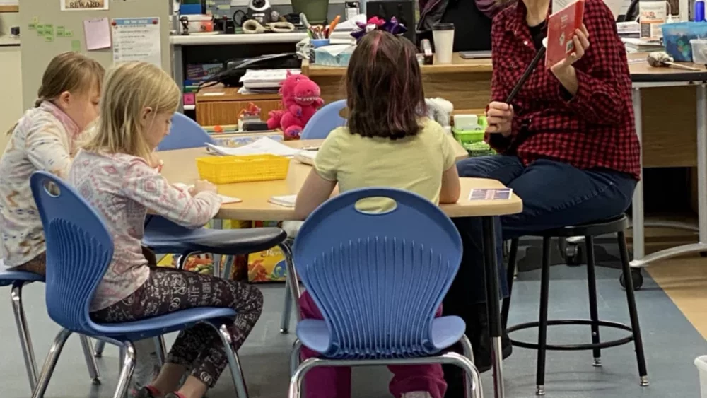 Beverly Colapietro working with students in a classroom