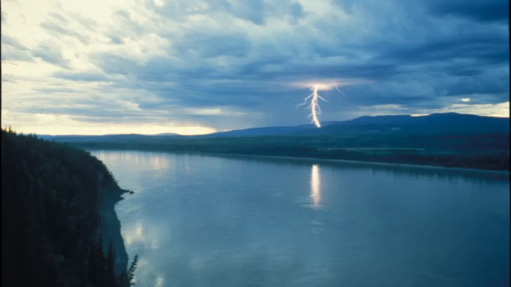 A lightning strike like this one in the Ray Mountains north of the Yukon River may have been responsible for the mysterious death of caribou in June 1972. Photo by Ned Rozell.