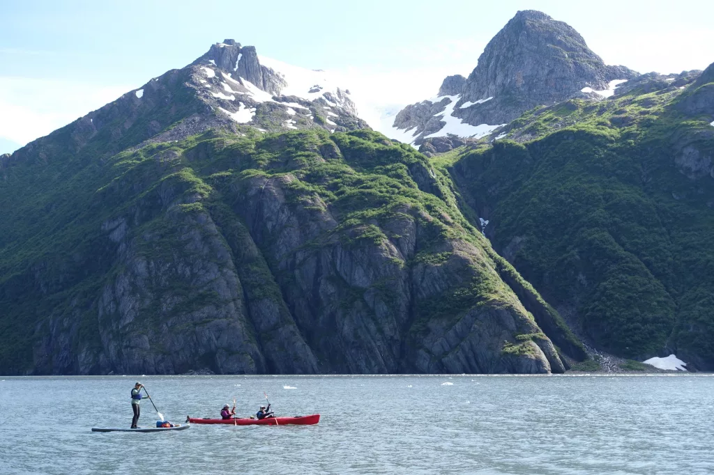 2. Boaters paddle Kenai Fjords National Park in summer 2024. The park was created in 1980 as part of the Alaska National Interest Lands Conservation Act. Photo by Ned Rozell.